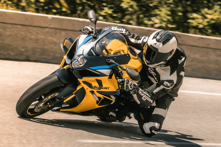 The clutch and magneto covers are finished in grey, while the exhaust silencer also get subtle cosmetic detailing Suzuki GSX-R1000R 40th Anniversary Edition in yellow cornering shot from left side